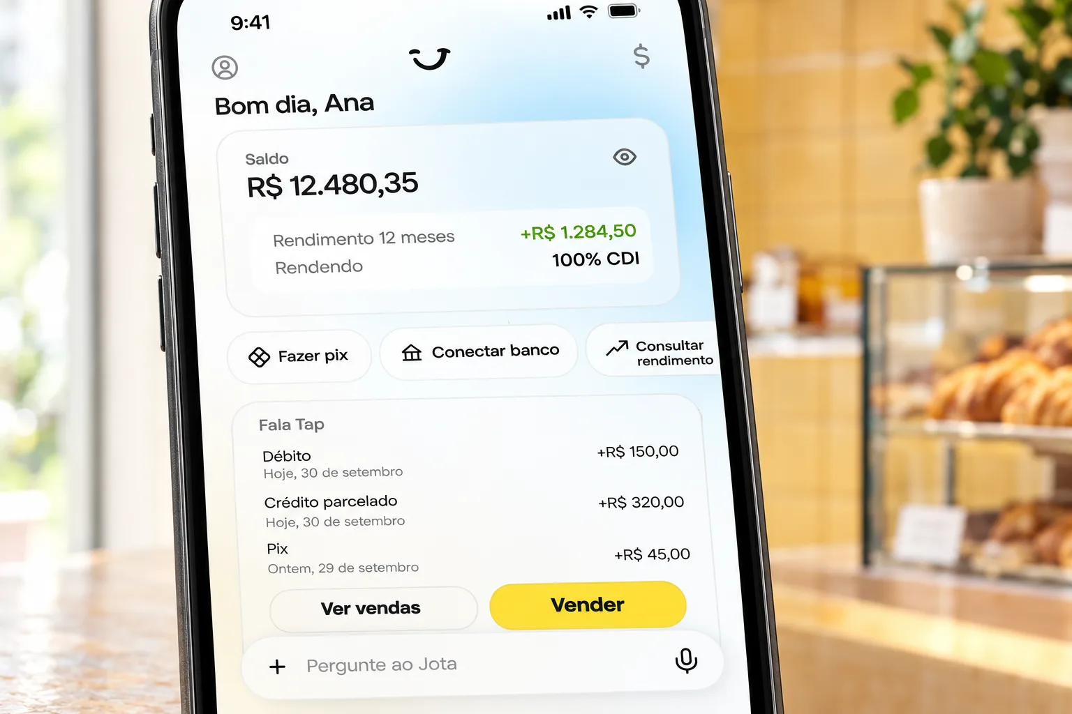 Tela inicial do app Jota exibindo saldo, rendimento a 100% do CDI e atalhos como Fazer Pix e Fala Tap.